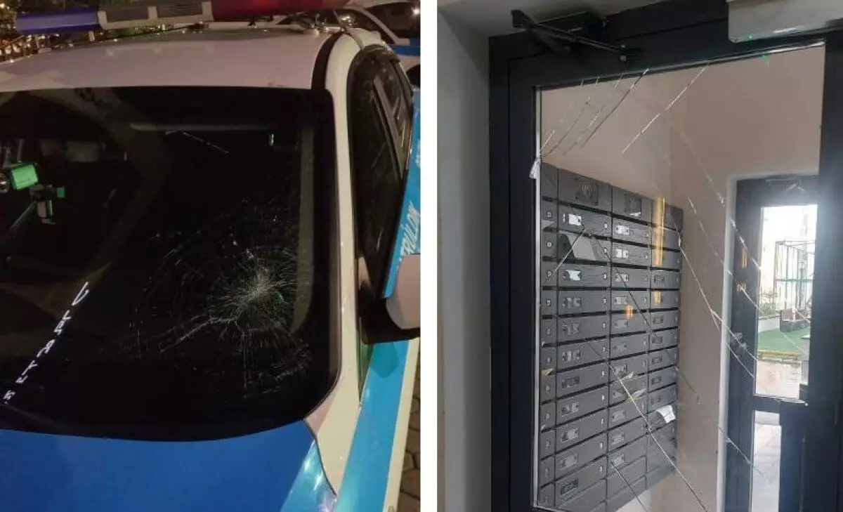 Женщина разбила сумкой лобовое стекло полицейской машины в Астане