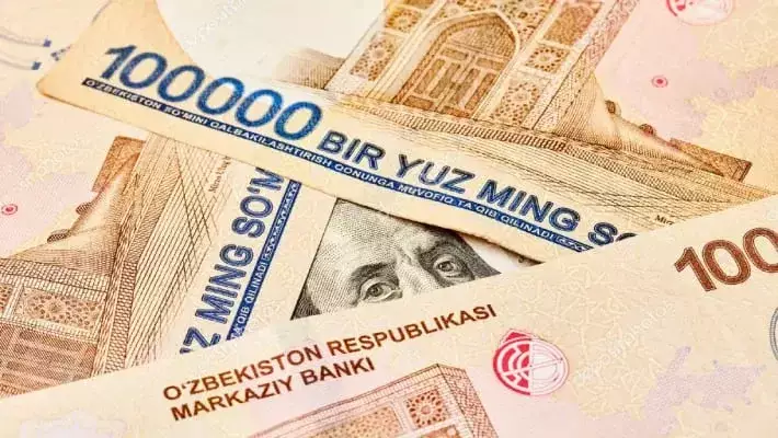 Официальный курс доллара опустился ниже 11 900 сумов