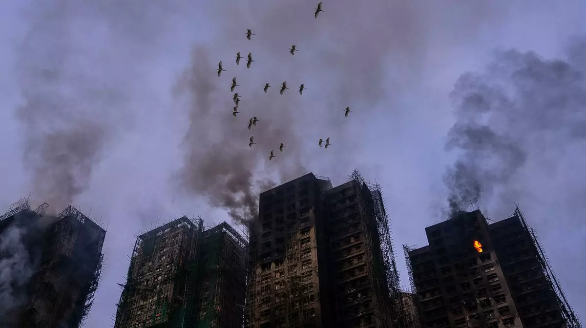 Число погибших при пожаре в Гонконге достигло 75 человек