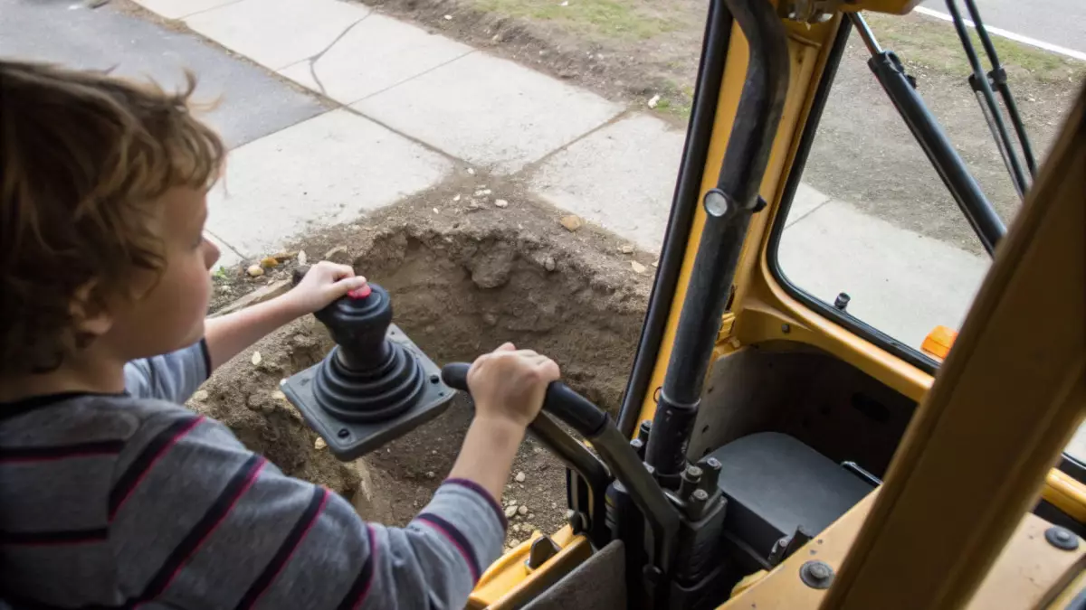 В Шымкенте мальчик сел в экскаватор и выкопал траншею на тротуаре